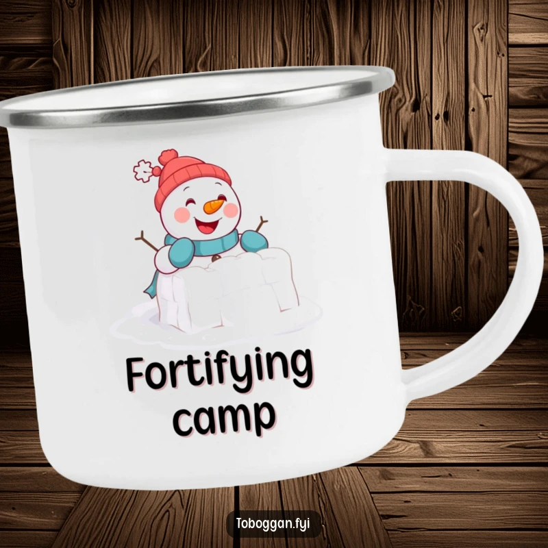 Funny Camping Mug: A cheerful snowman comically attempts to build a tiny snowball fort, perfect for outdoor enjoyment.
