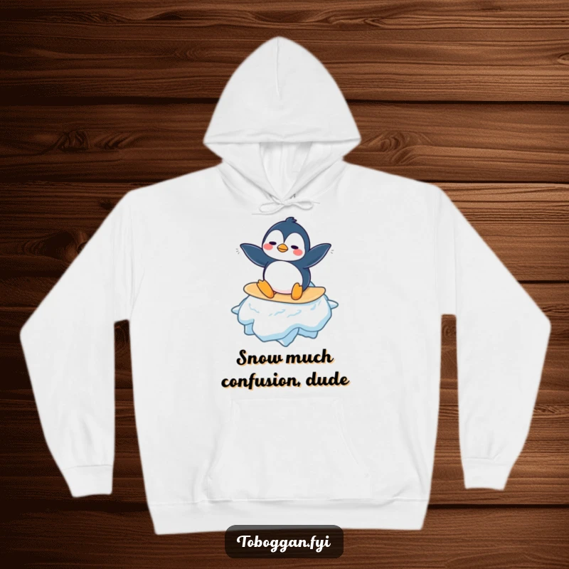 Funny Penguin Hoodie: A confused penguin character is illustrated trying to balance on a huge snowflake, creating a scene of cold-weather comedy.