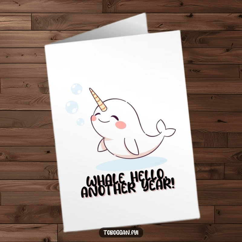 Funny Free Printable Birthday Card: Giggling narwhal joyfully blowing snow bubbles, creating a whimsical winter scene for laughter.