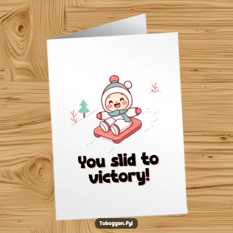 Funny Free Printable congratulations card: a cute character gleefully tobogganing down a snowy slope, celebrating success.
