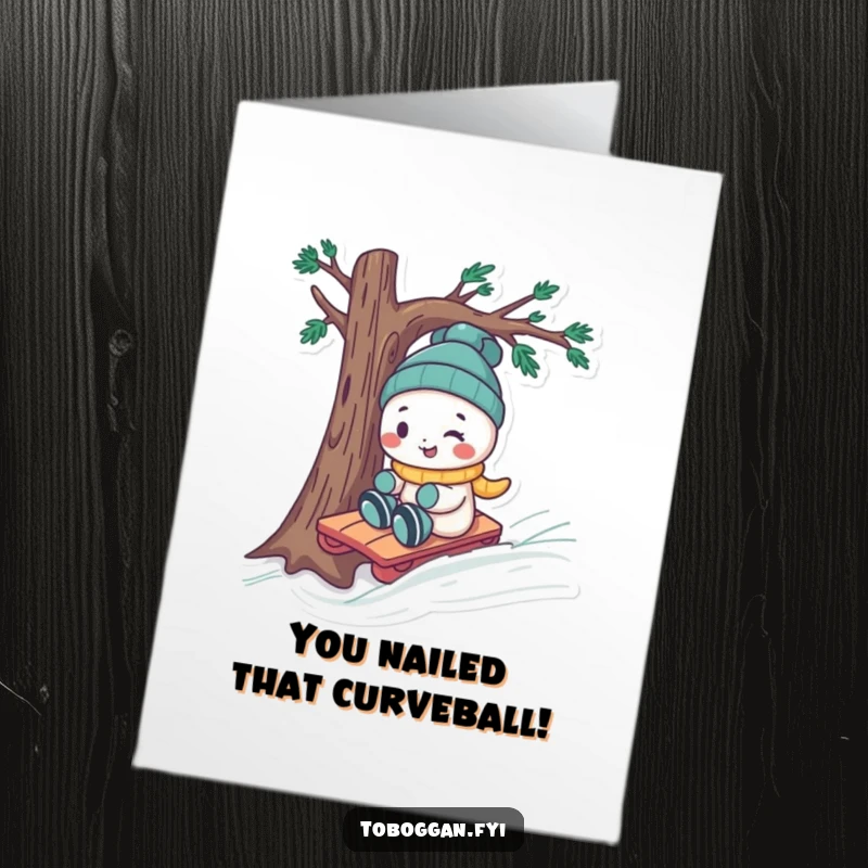 Free Printable Congratulations Card: A playful character with a cheeky smile expertly steers a toboggan around a tree, celebrating success.