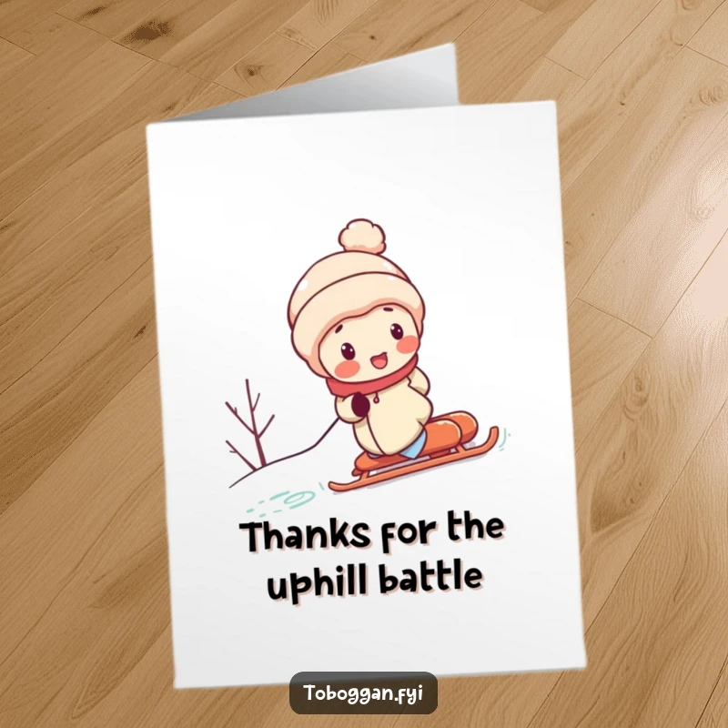 Funny free printable thank you card featuring a red-cheeked character straining to push a sled up a snowy hill.