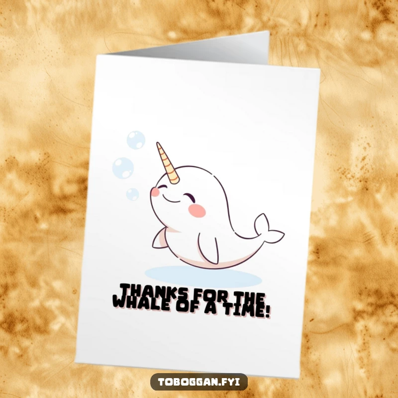 Funny Free Printable Thank You Card: Giggling narwhal comically blowing festive snow bubbles, a delightful way to say thanks.