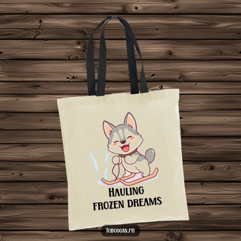 Funny tote bag featuring a happy husky comically pulling a giant icicle like a sled, for a humorous touch.